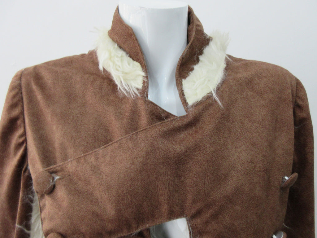 Split Suede Coat. Faux suede coat with faux fur contrast trim on lapels and inside. Flared towards hem with contrast faux fur panels. Rich saddle lighter brown colour. Feminine version inspired from 18th century men's evening coat. Multiple ways of buttoning as illustrated. Can be paired with 060301 Brown Suede Trouser. Formerly a showpiece, specially made. No Label. CB Length 94cm. Sleeve length from side shoulder point 75cm. 850g approximate weight. 95% Polyester, 5% Rayon. Contrast: 100% Viscose. Dry Cl