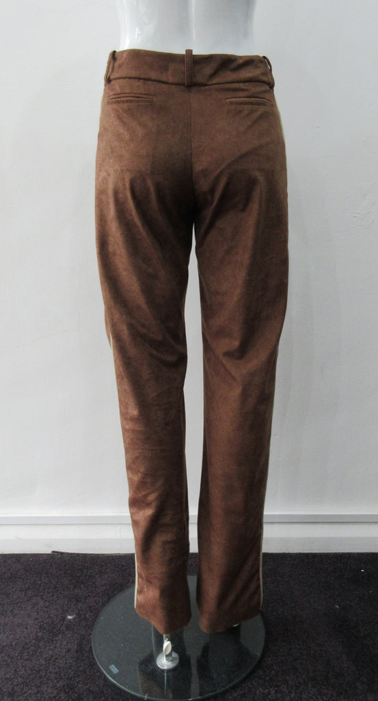Brown Faux Suede Trouser. Nicely tailored medium brown faux suede trousers with beige contrast piping. Front angle invisible zip pockets. Can be paired with 060218 Split Suede Coat. Formerly a showpiece, specially made. Inseam 83cm. Outseam 103cm. 400g approximate weight. 95% Polyester, 5% Nylon. Dry Clean Only. Made in Canada