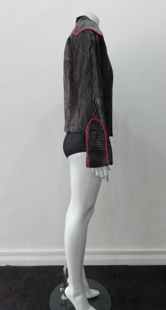 Side Zip Jacket. Assymetrical side front zip jacket featuring abstract stitching incorporated into the fabric for a geometric feel. Rich deep grey colour with pink piping accents on shoulder and sleeve panels. Fully lined. CB length 53cm. Sleeve length from side neck point 75cm. 400g approximate weight. 29% Nylon, 22% Viscose, 28% Cotton, 12% Linen, 2% Polyester. Lining: 100% Rayon. Dry Clean Only. Made in Canada