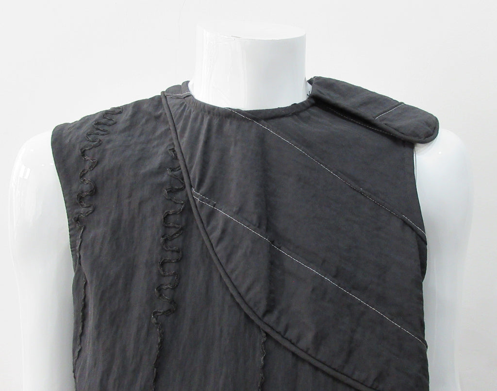 Black Flap Shoulder Dress. The ideal little black sleevelss dress featuring assymetric styling with piping. CB invisible zipper. Fully lined. Size 8