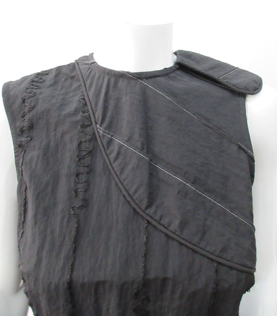 Black Flap Shoulder Dress. The ideal little black sleevelss dress featuring assymetric styling with piping. CB invisible zipper. Fully lined. Size 8