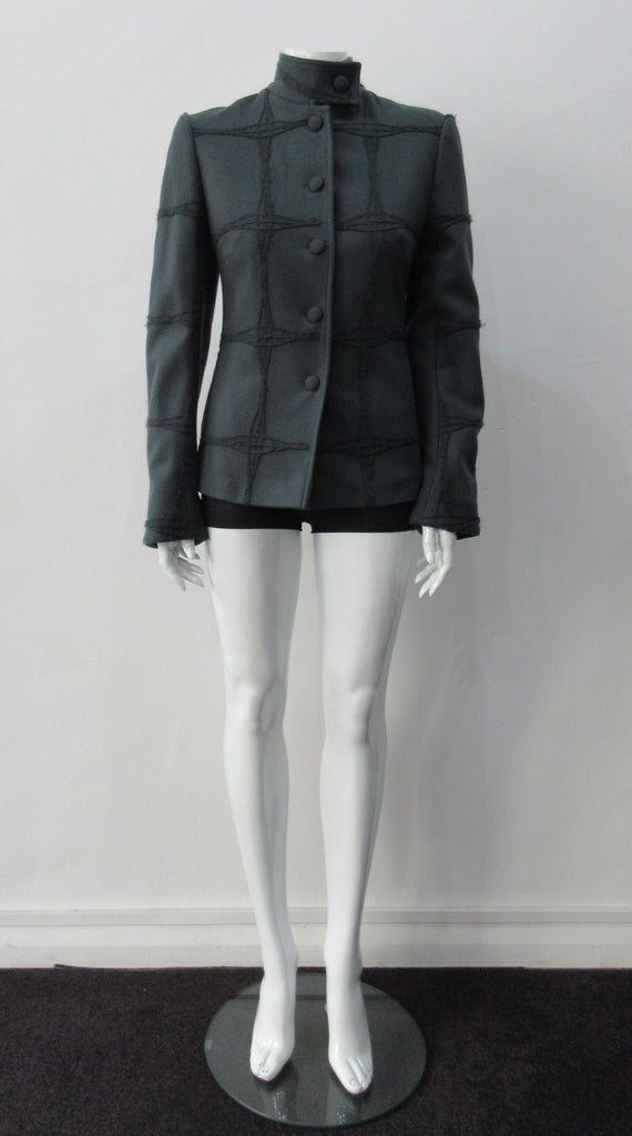 Wobbler Jacket. Tailored jacket with button collar and covered buttons in deep taupe grey, with a slight military feel. Features neo-classical trim design which naturally becomes fuzzy over time as a design detail. Size 8