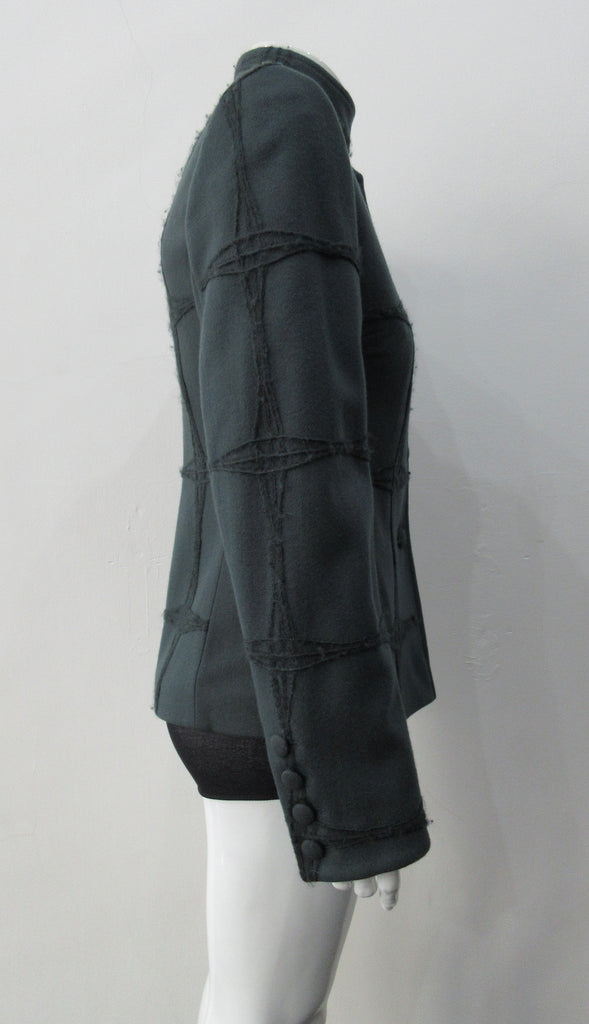 Wobbler Jacket. Tailored jacket with button collar and covered buttons in deep taupe grey, with a slight military feel. Features neo-classical trim design which naturally becomes fuzzy over time as a design detail. Size 8