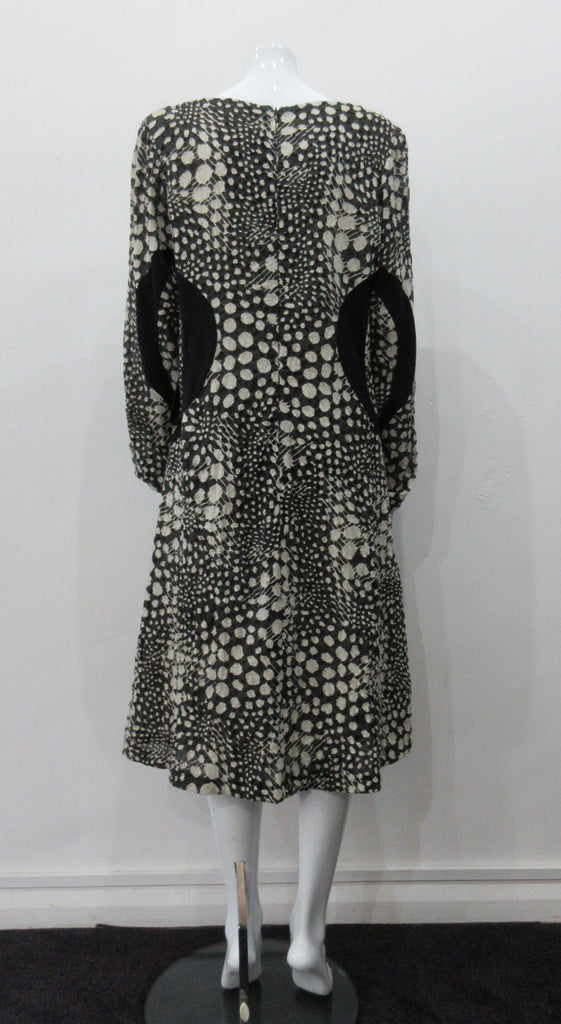 090119 Side Sport Panel Dress Gentle swing dress in abstract black & white mod textile design with black solid panels on sides and under scooped neckline.