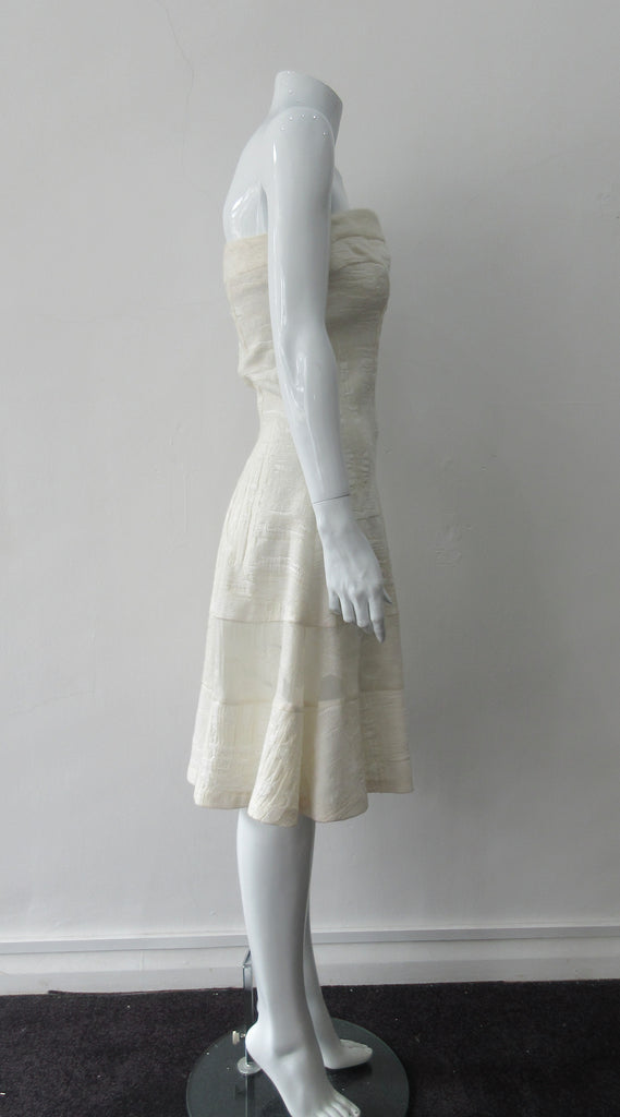 Multi corded velvet and floral trimmed off white dress with top panel for comfortable fit. Flattering slight swing below the waist for bit of ease. Size 8 CB Length 93cm 450g approximate weight 62% Viscose, 20% Wool, 15% Silk, 3% Cotton Contrast: 38% Nylon, 26% Wool, 20% Cotton, 16% Viscose Dry Clean Only Made in Croatia