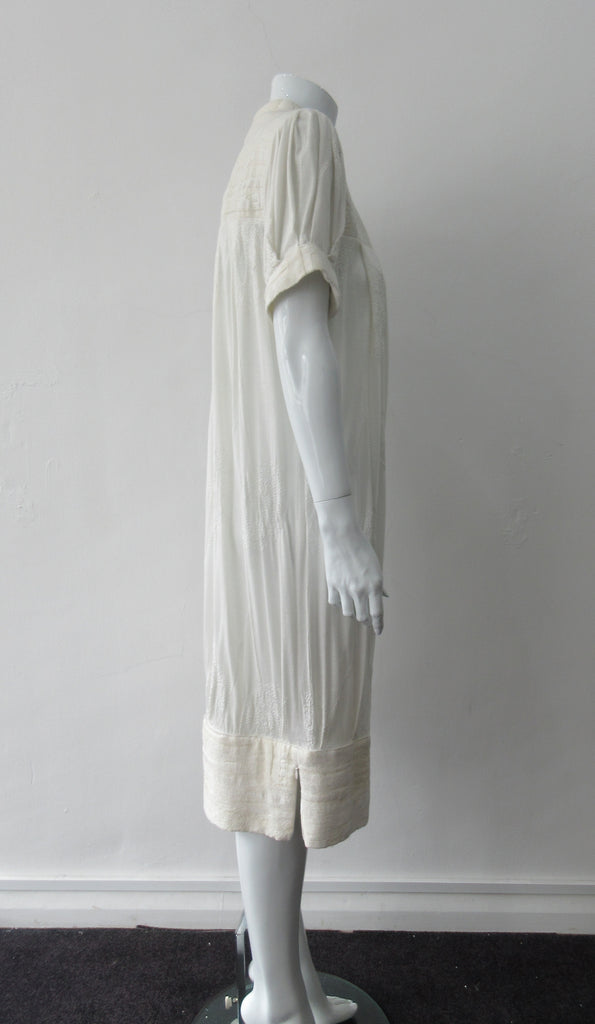 Half Pleat Dress: Art-Nouveau style with pleats to add fullness into tapered hem. Invisible zipper on shoulder. Falls mid calf Size 8. CB Length 105cm, 350g approximate weight. 62% Viscose, 20% Wool, 15 %Silk, 3% Cotton Contrast: 46% Modal, 34% Nylon, 10% Angora, 10% Viscose, Dry Clean Only, Made in Croatia