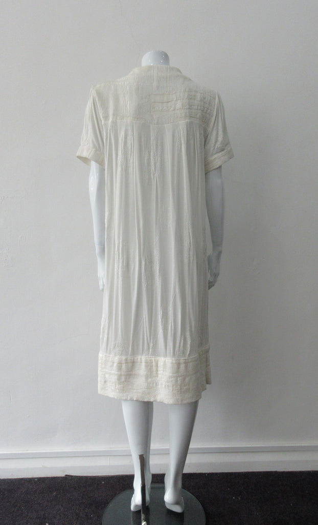 Half Pleat Dress: Art-Nouveau style with pleats to add fullness into tapered hem. Invisible zipper on shoulder. Falls mid calf Size 8. CB Length 105cm, 350g approximate weight. 62% Viscose, 20% Wool, 15 %Silk, 3% Cotton Contrast: 46% Modal, 34% Nylon, 10% Angora, 10% Viscose, Dry Clean Only, Made in Croatia