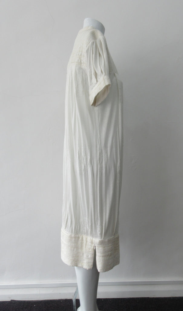 Half Pleat Dress: Art-Nouveau style with pleats to add fullness into tapered hem. Invisible zipper on shoulder. Falls mid calf Size 8. CB Length 105cm, 350g approximate weight. 62% Viscose, 20% Wool, 15 %Silk, 3% Cotton Contrast: 46% Modal, 34% Nylon, 10% Angora, 10% Viscose, Dry Clean Only, Made in Croatia