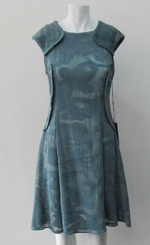 Trenched Swing Dresss. Dark sea green textured dress with trenchcoat-style panels. With CB zipper. CB length 92cm. 600g approximate weight. 37% Nylon, 25% Wool, 20% Cotton, 15% Viscose, 3% Silk. Dry Clean Only, Made in Croatia