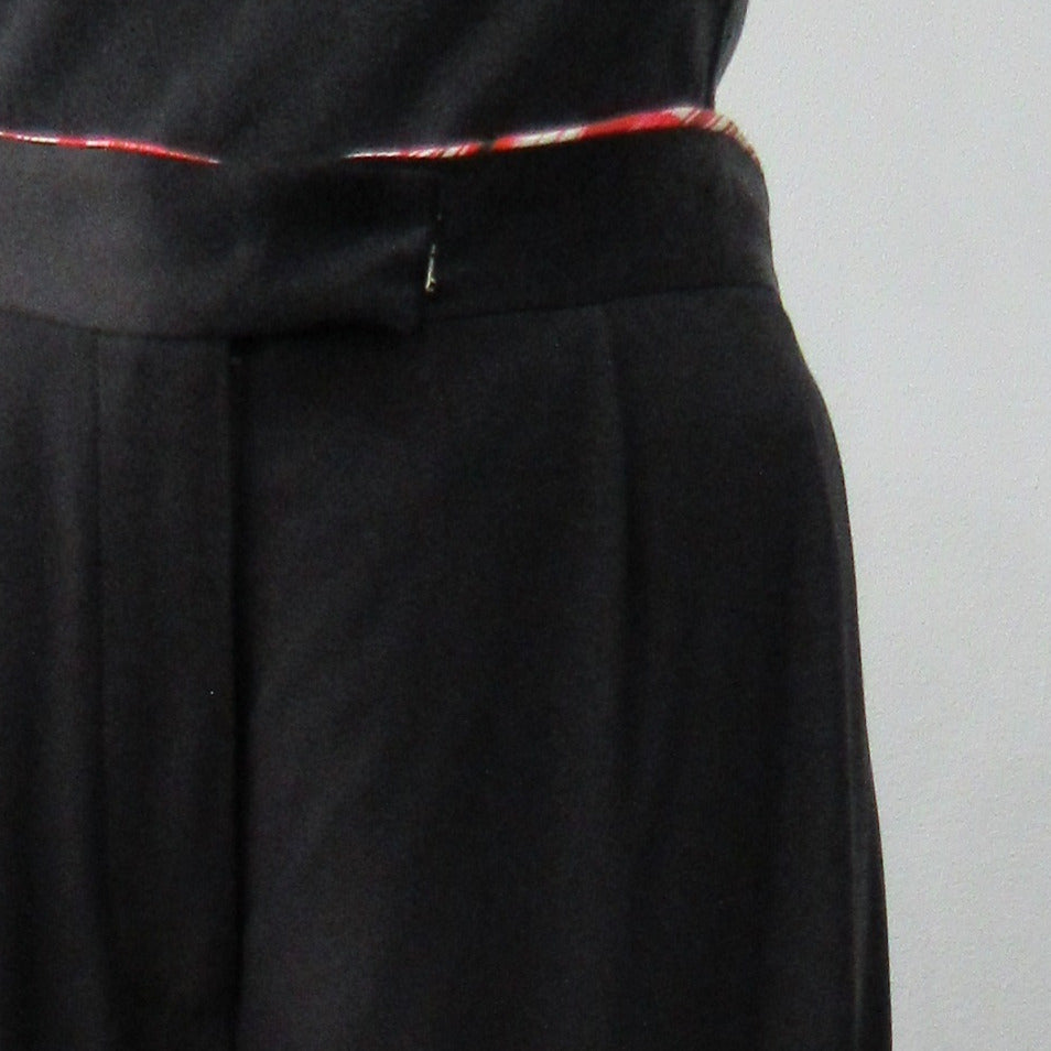 Soft flowing flared trouser with inside cntrast waistband trim. Black colour. Size 10 Inseam 81.5cm, Outseam 106cm, 100% Polyester Contrast: 100% Silk, Dry Clean Only, 240g approximate weight. Made in England