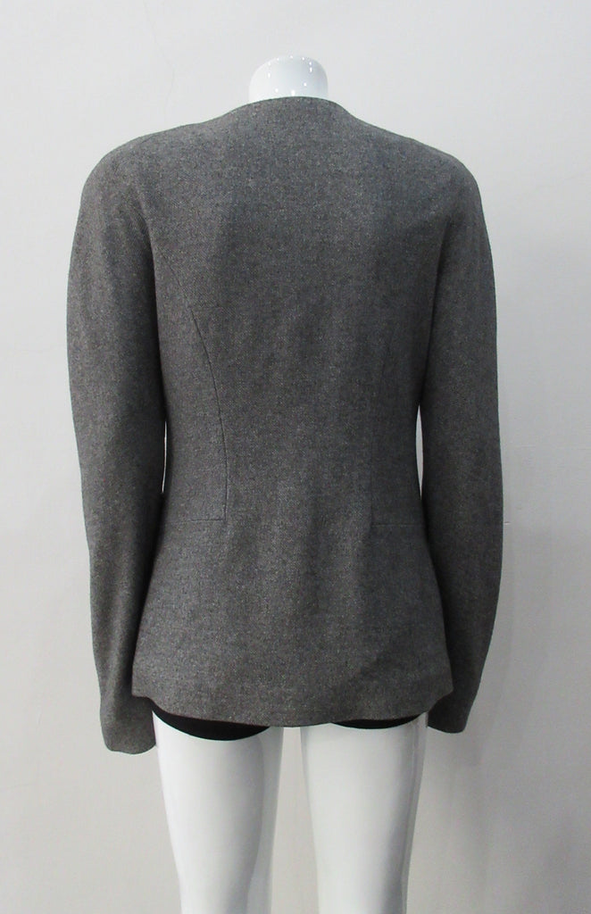 False Peak Jacket. Old-School Jacket in charcoal grey with rounded shoulders. Design features sewn in collar and lapel. Covered buttons throughout. Relaxed fit. Size 8