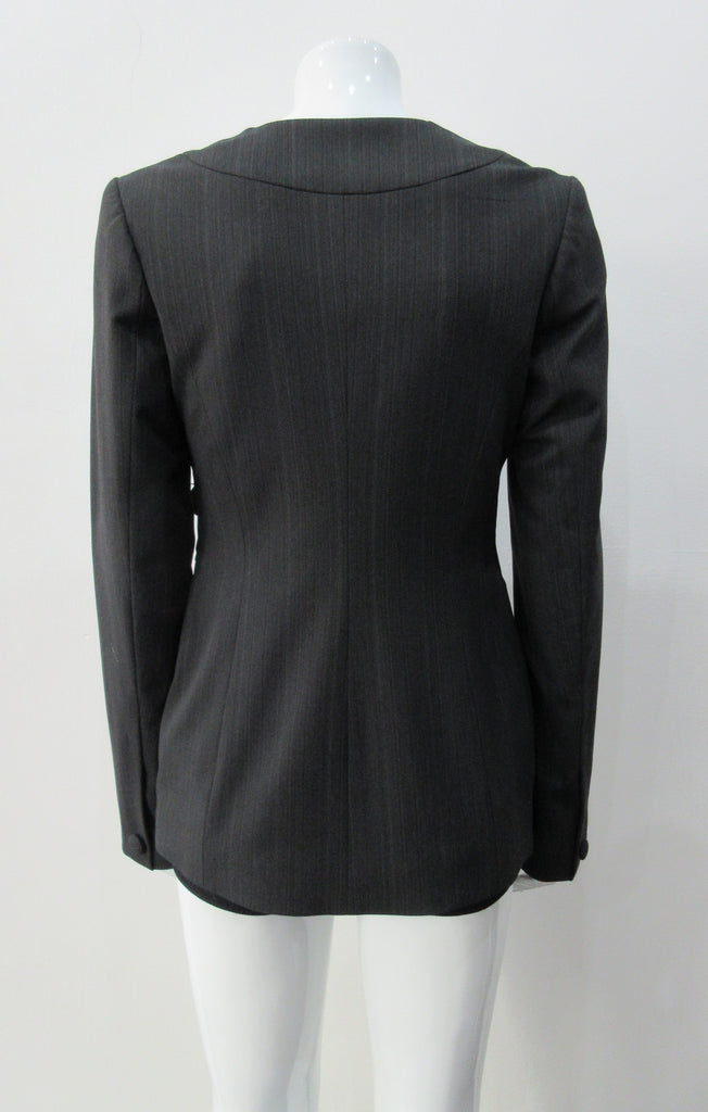 Collarless jacket featuring faux collar details with an overall tailored feel, in dark greyish brown colour. Fabric has very fine stripes. Covered buttons throughout with 1 button CF closure.