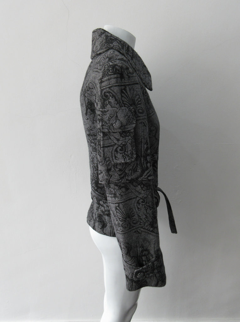 Swing Sleeve Jacket, Military crop style Roman Garden style print wool jacket with a multitue of Cargo pockets on front and upper sleeves. Also larger collar, trench style vents under pockets and tie-front at jacket bottom. Jacket CB length 61.5cm. Sleeve Length fron side neck 80cm. 700g approximate weight. 100% Wool, Lining 100% Rayon, Dry Clean Only.Made in Croatia