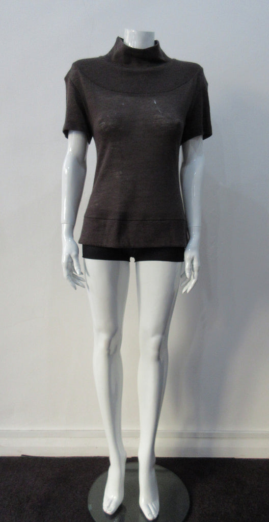 T-Shirt style with short sleeves featuring curved panel parallel to neckline and soft dropped round collar. Soft wool fine knit in rich brown colour. Size 8