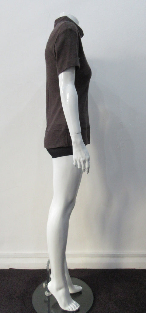 T-Shirt style with short sleeves featuring curved panel parallel to neckline and soft dropped round collar. Soft wool fine knit in rich brown colour. Size 8