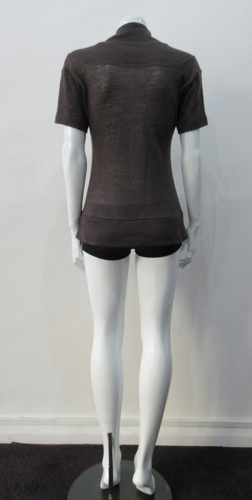 T-Shirt style with short sleeves featuring curved panel parallel to neckline and soft dropped round collar. Soft wool fine knit in rich brown colour. Size 8