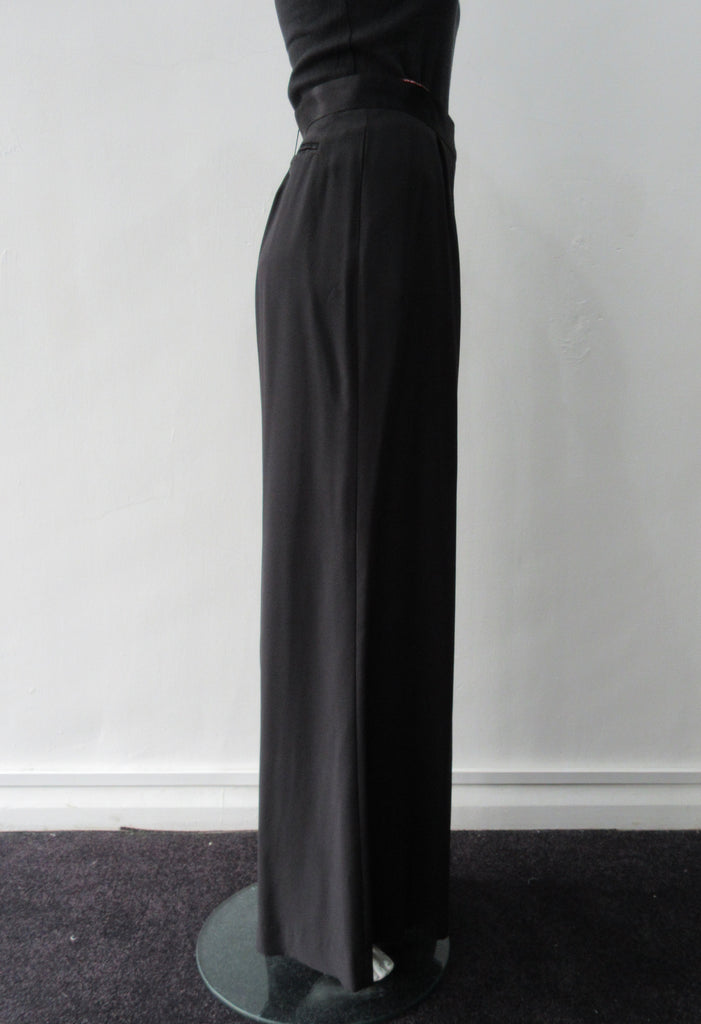 Soft flowing flared trouser with inside cntrast waistband trim. Black colour. Size 10 Inseam 81.5cm, Outseam 106cm, 100% Polyester Contrast: 100% Silk, Dry Clean Only, 240g approximate weight. Made in England