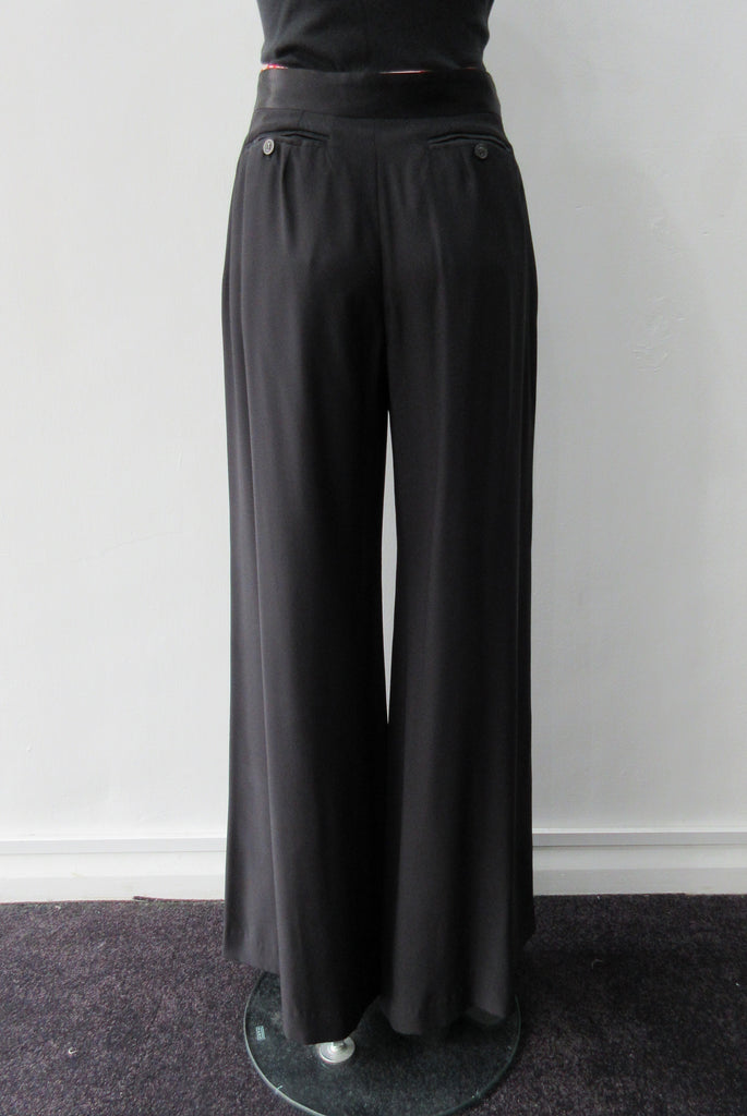 Soft flowing flared trouser with inside cntrast waistband trim. Black colour. Size 10 Inseam 81.5cm, Outseam 106cm, 100% Polyester Contrast: 100% Silk, Dry Clean Only, 240g approximate weight. Made in England