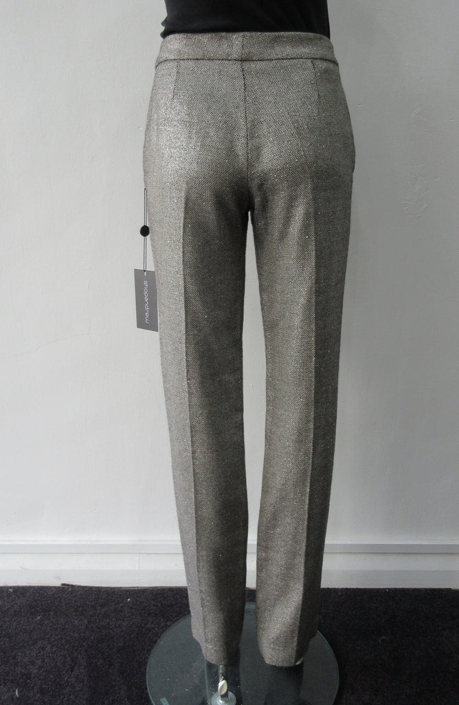Soft micro-tweed with slight shine. 53% Wool, 31% Viscose, 14% Silk, 2% Polyeurathane. Size 8, Inseam 82.5cm, Outseam 102cm, Dry Clean Only, Made in England.