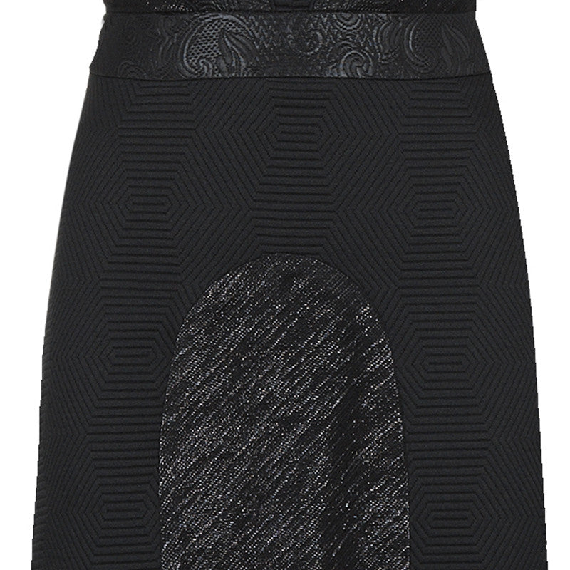 Dark sleeveless midi length dress reveals the side of bust ever so slightly. Black floral jacquard on the breast plate accented with shiny floral that curves around waist in a halter cut. Paired with the diamond print in this slight a-line dress. 55%Cotton, 45% Polyester. Contrast: 48% Acetate, 32% Cotton, 10% Viscose, 10% Lurex. Lining: 100% Rayon. Dry Clean Only. Made in England