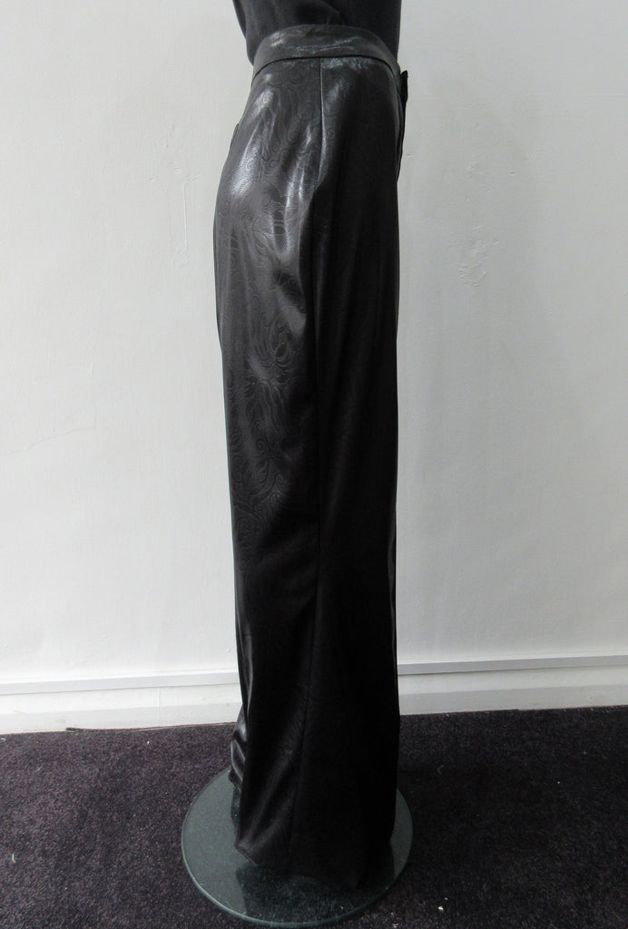 Shiny PVC style looser cut trouser with curved back panel. Extra long legs good for taller person. In black colour. Size 10 Inseam 86cm, Outseam 118cm 73% Acrylic, 22% Nylon, 3% Elastine Lining 100% Nylon Dry Clean Only Made in England