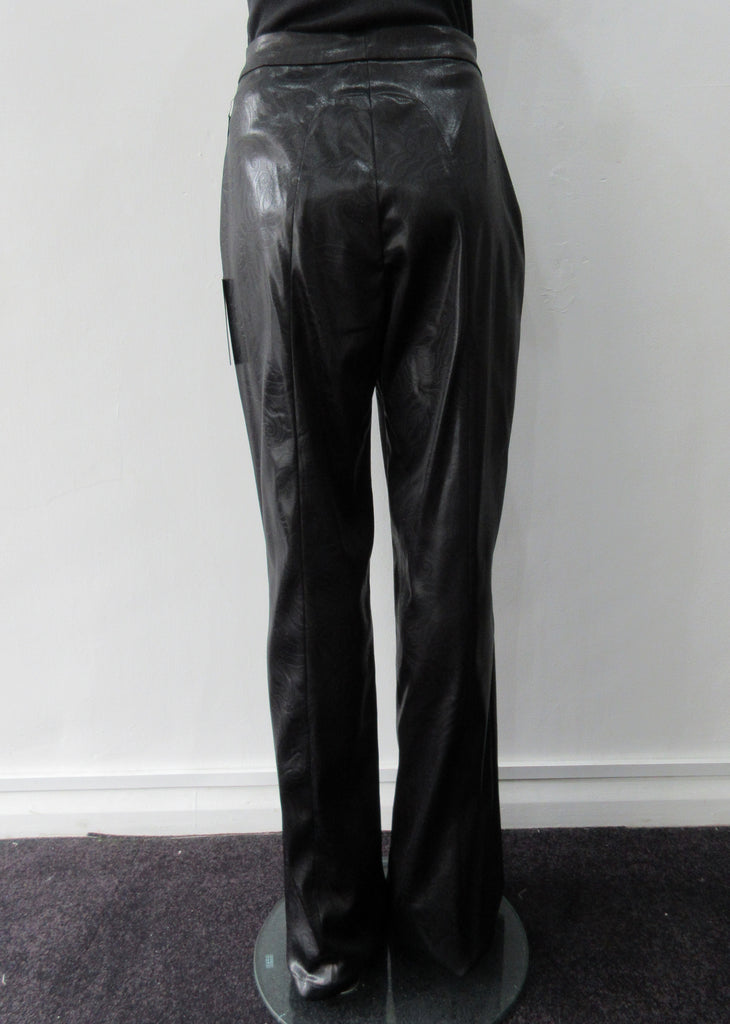 Shiny PVC style looser cut trouser with curved back panel. Extra long legs good for taller person. In black colour. Size 10 Inseam 86cm, Outseam 118cm 73% Acrylic, 22% Nylon, 3% Elastine Lining 100% Nylon Dry Clean Only Made in England