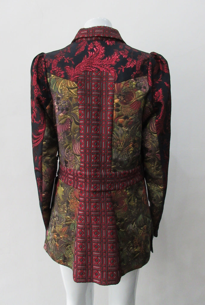 Collared Top Multi-Combined textured fabric in brass, purlple brocade and red floral for sleeves. CF buttons in shiny quartz-like glass and large Peter Pan style collar CB jacket length 71cm 250g approximate weight 65% Cotton, 35% Polyester Contrast: 60% Acetate, 28% Polyester, 12% Polyamide Dry Clean Only. Made in England