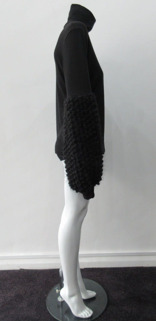 Fluffy Sleeve Top. Extremely soft Cotton/Lycra knit top with 11.5cm high collar. Soft curly sleeve contrast below elbow to cuffs. CB length from neckpoint 64cm. 210g approximate weight. 96% Cotton, 2% Lycra. Contrast 100% Viscose. Dry Clean Only. Made in Canada