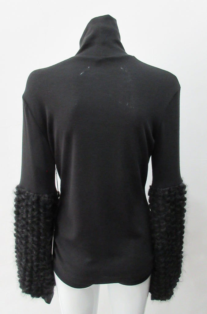 Fluffy Sleeve Top. Extremely soft Cotton/Lycra knit top with 11.5cm high collar. Soft curly sleeve contrast below elbow to cuffs. CB length from neckpoint 64cm. 210g approximate weight. 96% Cotton, 2% Lycra. Contrast 100% Viscose. Dry Clean Only. Made in Canada