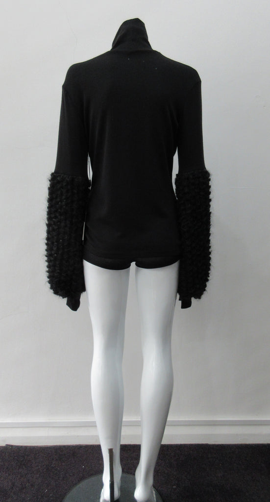 Fluffy Sleeve Top. Extremely soft Cotton/Lycra knit top with 11.5cm high collar. Soft curly sleeve contrast below elbow to cuffs. CB length from neckpoint 64cm. 210g approximate weight. 96% Cotton, 2% Lycra. Contrast 100% Viscose. Dry Clean Only. Made in Canada