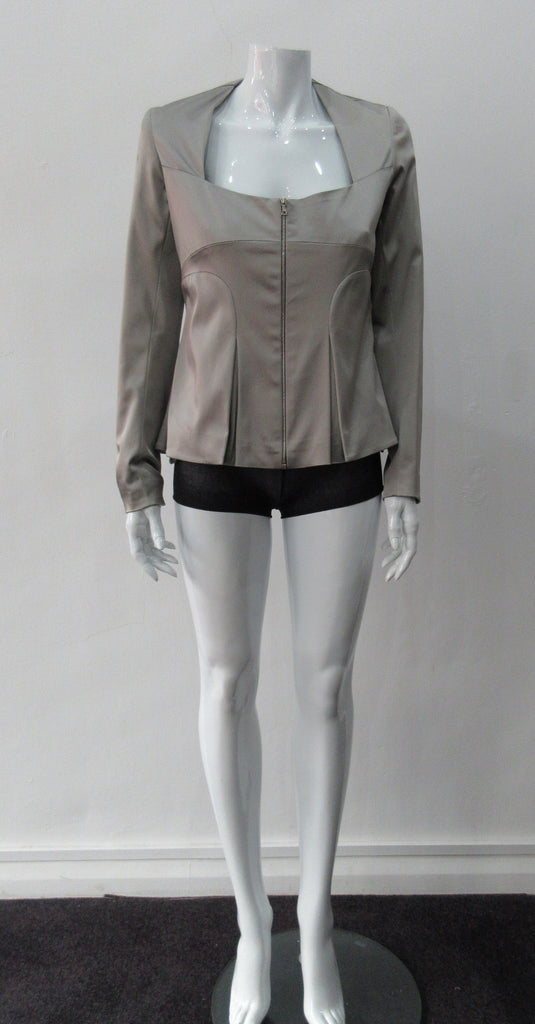Corset Jacket. Geometric cut lower front metal zip jacket with flared peplum-style hem in medium length. Designed for a tighter fit around the bust area. In solid silver taupe colour with slight stretch. CB length 63cm. Sleeve length from side neck point 78cm. 750g approximate weight. 95% Polyester, 5% Spandex. Lining: 100% Viscose. Dry Clean Only. Made in England