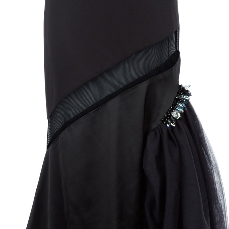 Black sequin and multipanel satin dress with black left thigh gathered tulle with clear bead accent, single strap and conceal zip closure. 62% Viscose, 3% Elastine, 35% Polyethylene. Contrast: 95% Polyester, 5% Spandex. Lining: 100% Viscose. Dry Clean only. Made in England