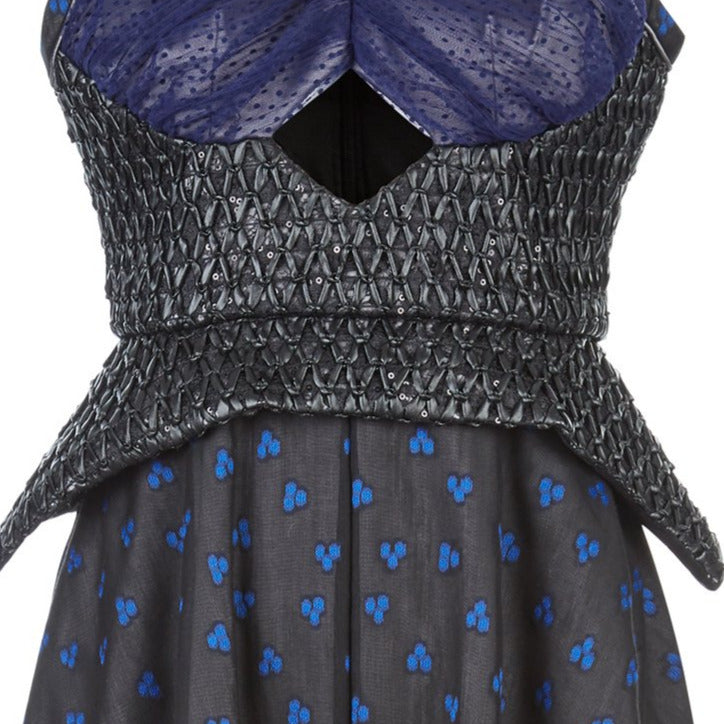 Sleevelss dress combination of blue ruched bust area with black faux leather thin peplum aspect and mid-waist panel. Gathered flounces on lower dress adds volume and greater movement. Small gap in middle of bust. 650g approximate weight. 81% Polyester, 14% Polyamide, 5% Elastine. Contrast 48% Polyester, 34% Cotton, 18% Nylon. Dry Clean Only. Made in England