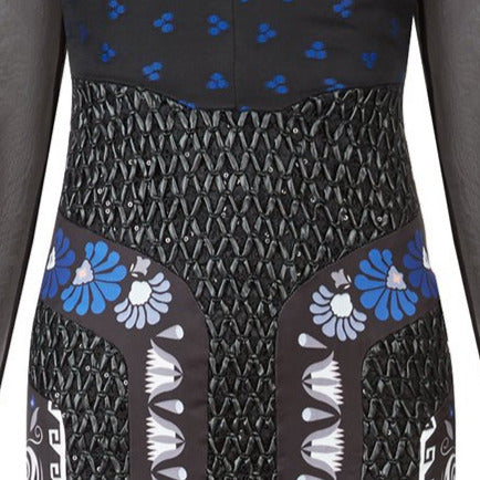 Full length multi-textured print dress featuring faux leather criss-cross paneling and black sheer sleeves. Semi-open top shoulders. Upper bodice has black with blue spotted design.