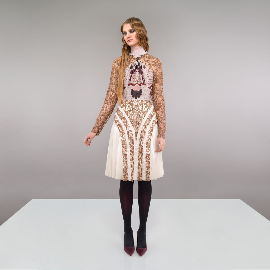 Print Tri-Point Dress. Sample sold as-is, no return, no refund. Contrast sequined and beaded gold lace contrast panels. Subtle floral print design on bodice. Full pleats below hip. CB invisible zipper. High ruched collar.