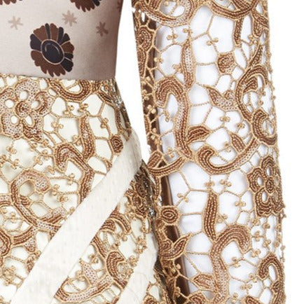 Print Tri-Point Dress. Sample sold as-is, no return, no refund. Contrast sequined and beaded gold lace contrast panels. Subtle floral print design on bodice. Full pleats below hip. CB invisible zipper. High ruched collar.