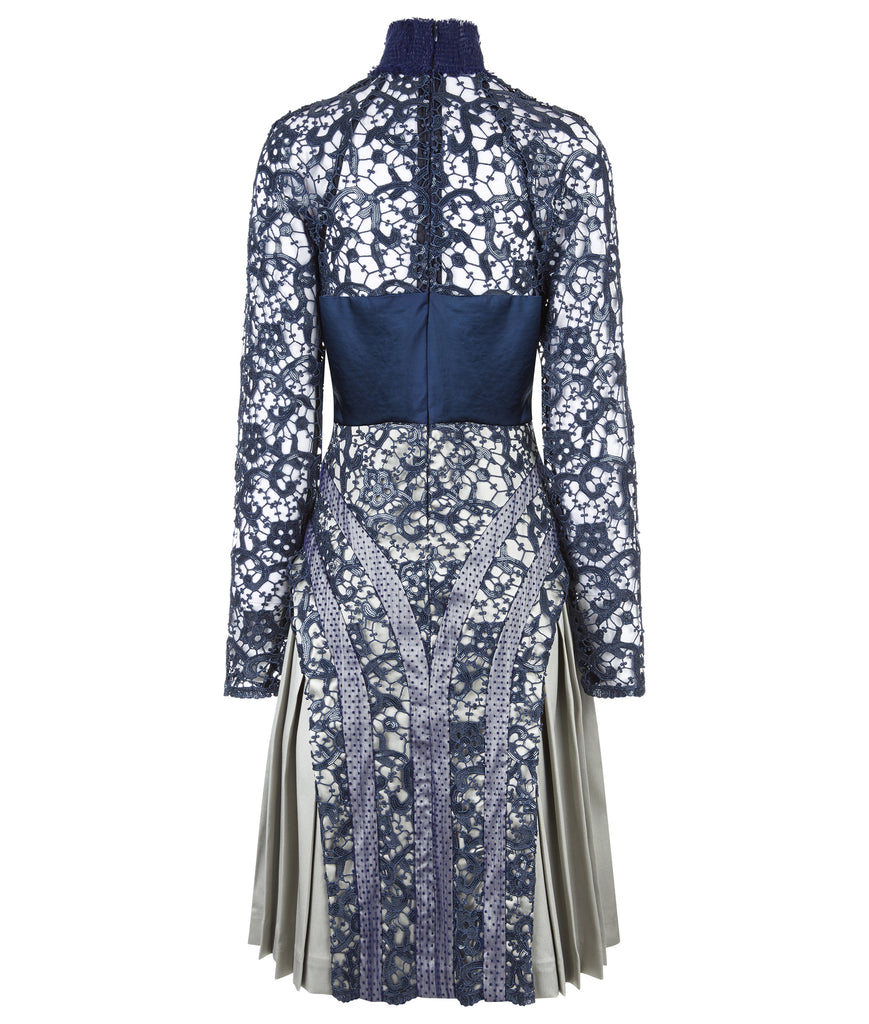 Elegant sequined lace dress in blue satin panel contrast and beige satin pleats. Ruched neckline with natural fraying effect. CB invisible zipper. 1.1kg approximage weight. 100% Polyester. Contrast: 81% Polyester, 14% Polyamide, 5% Elastine Dry Clean Only. Made in England