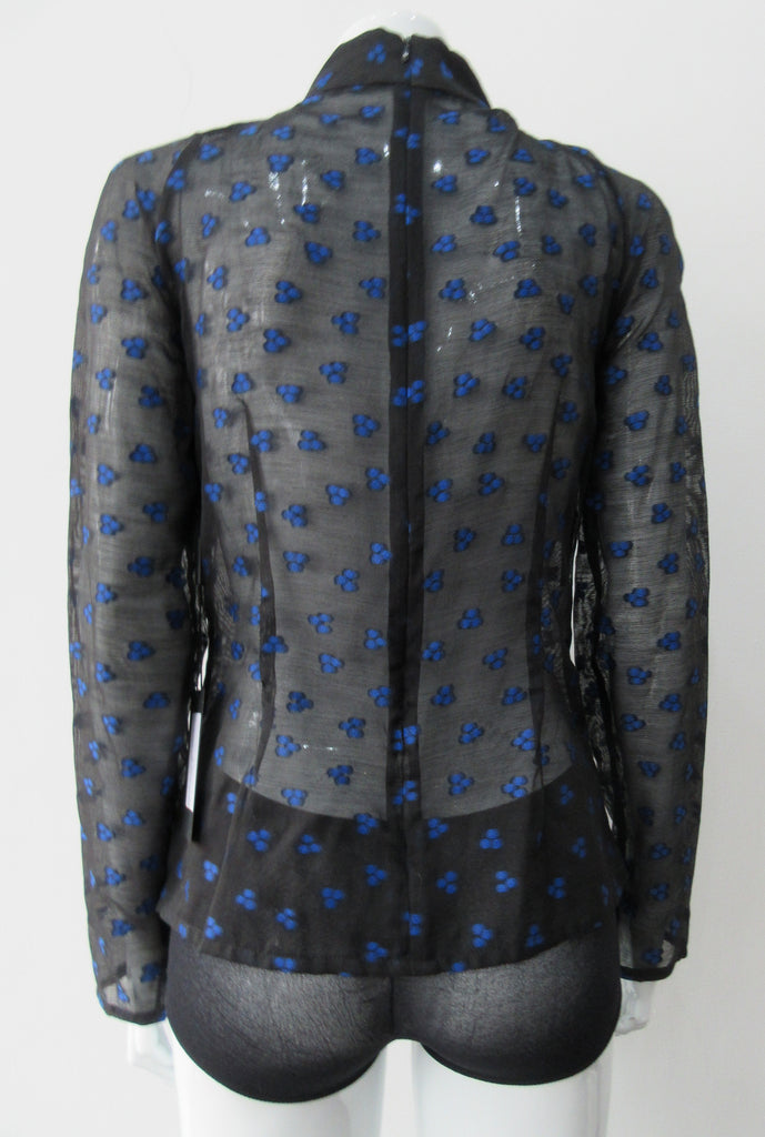 Dark Gathered Top, Generously gathered long sleve top in sheer black with tri-blue dot design. CB zipper and under bust panel trim. 2 invisible side zippers at side seam bottom. Can be paired with 180608D Dark Curve Front Pencil Skirt, CB length 60cm. 50g approximate weight 48% Polyester, 34% Cotton, 18% Nylon. Dry Clean Only. Made in England