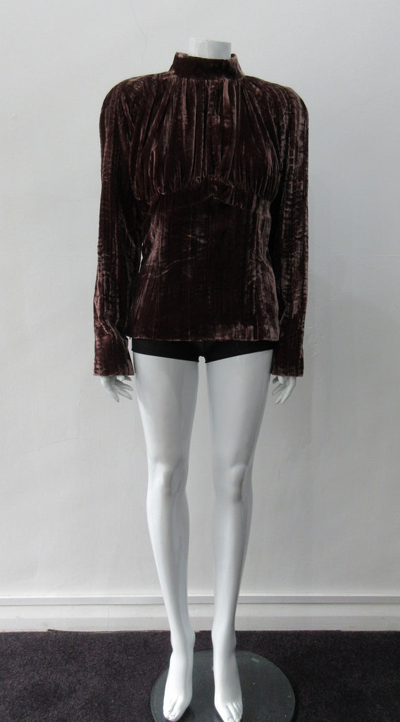 Gathered Top. Rich long sleeve top in deep red-grey streaked velvet. Panel details under bustline to accentuate fit. CB zip and 4.5cm wide collar. Fully lined. CB length from neckpoint 60cm, sleeve length 79cm from side neck point. 450g approximate weight. 75% Viscose, 25% Nylon. Lining 100% Rayon. Dry Clean Only. Made in England