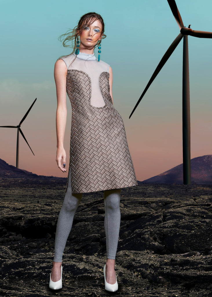 Deep Dip Dress. Sleeveless shift dress in rectangular diagonal tiled weave design in taupish brown. CF dips below bustline, almost to waistline, compiled with sea green sheer mesh. Rib knit collar 4.5cm height. Dress length from CB neckpoint 91.5cm. 50g approximate weight. 80% Nylon, 20% Viscose Contrast: 100% Nylon. Dry Clean Only. Made in England