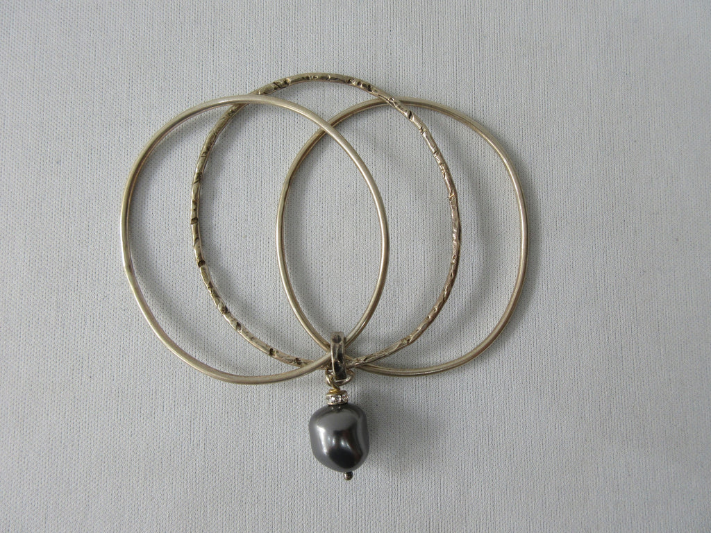 Karyn Choppik Multi 3 Ring Bracelet with Swarowski Pearl, Sterling Silver Bracelets, 1 textured. Combined and attached with Antiquated Brass ring attaching the pearl. Size M -6.3cm inside diameter x1 Size L -6.8cm inside diameter x1, 40g approximate weight, Made in Canada