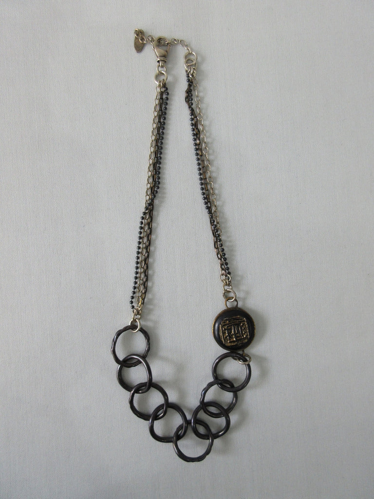 20A51 -Karyn Chopik 8 Ring & Medallion Necklace