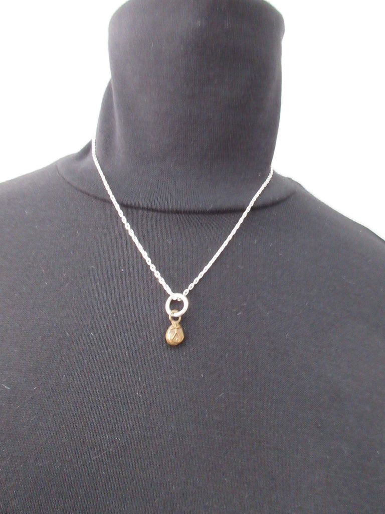 20A63 Brass Person Figure Steel Necklace Brass person attached to stainless steel chain. Full length when worn 25cm. 12 grams approximate weight.