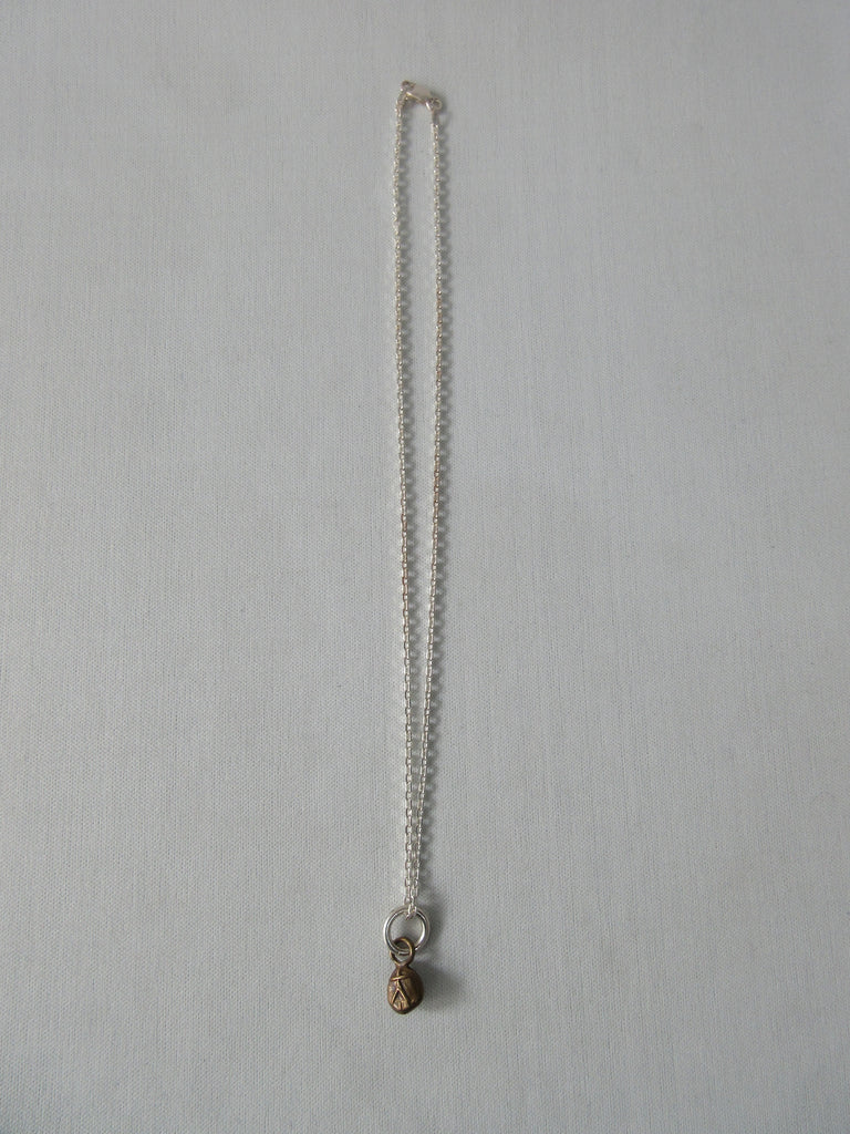 20A63 -Brass Person Figure Steel Necklace