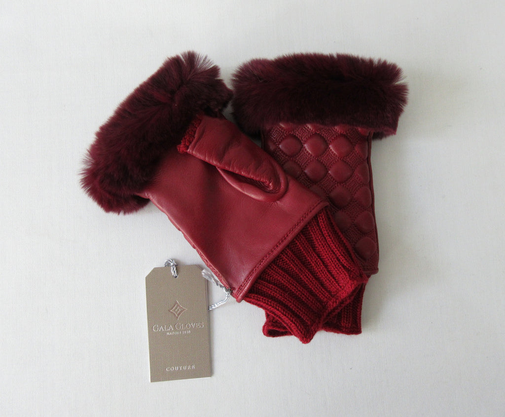 Gala Gloves Couture Red Fingerless Gloves, Item Number D596NALAD261RUB 948.010. Ruby Red coloured textured leather with knit base, leather fingerless glove with fur trim for fingers. Fur unknown. 80g approximate weight. Made in Italy