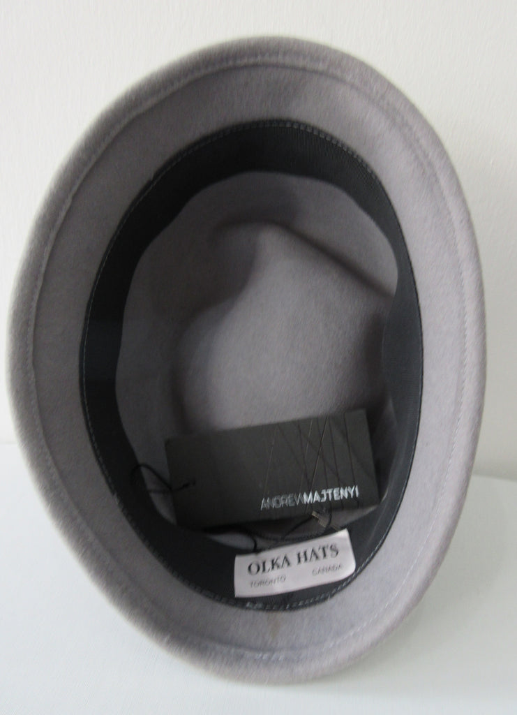 Olka Hats 100% Wool with dark grey felt and Sequin trim. Size unknown, 58.5cm inside circumfrence. Length 26.5cm, Width 20cm, Height 12cm, 26g approximate weight. 100% Wool Made in Canada