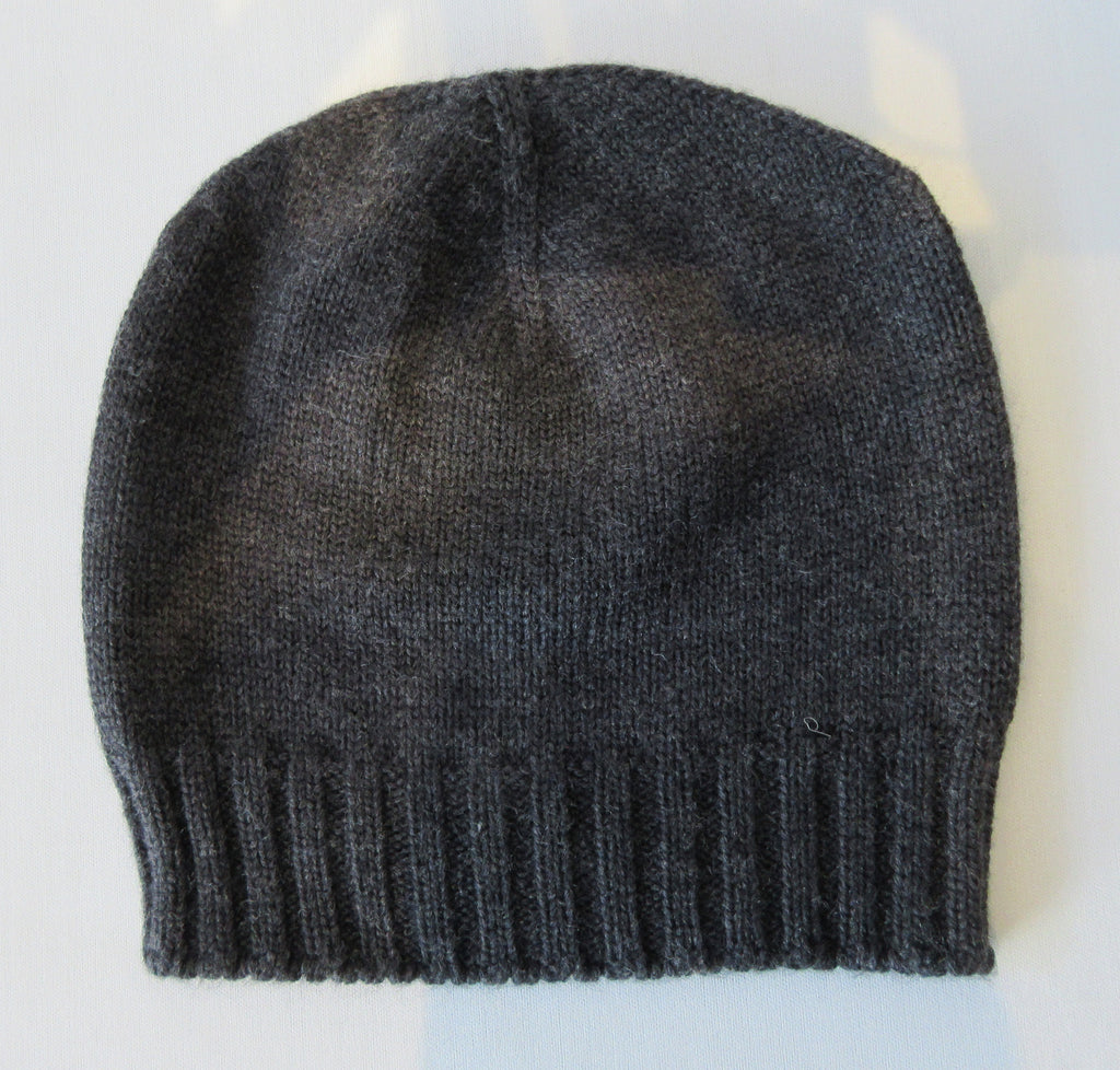 Charcoal Dark Crystal Hat. Knit Cap in Charcoal with mini Swarowski crystals on front. Crystals can be displayed full front or worn sideways. Article 90717 TG A/M. Width 22cm, Height 21cm. 50g approximate weight. 100% Wool Hand wash, Hang dry only. Made in Italy