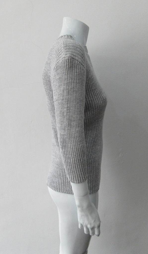 Grey rib knit cardigan with open shoulder applique design on left side. CB Length 60cm, Sleeve Length 54cm, 100% Cotton, Hand wash cold seperately, Dry flat to re-shape. 450g approximate weight, Made in China