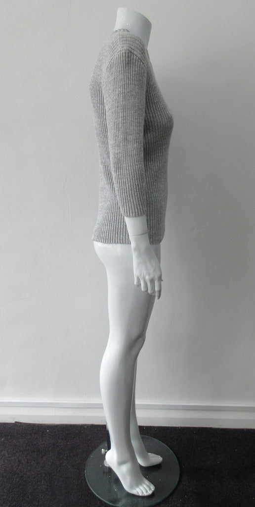 Grey rib knit cardigan with open shoulder applique design on left side. CB Length 60cm, Sleeve Length 54cm, 100% Cotton, Hand wash cold seperately, Dry flat to re-shape. 450g approximate weight, Made in China