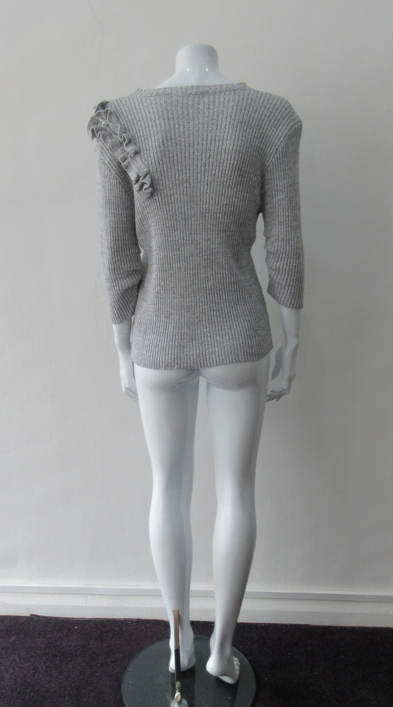 Grey rib knit cardigan with open shoulder applique design on left side. CB Length 60cm, Sleeve Length 54cm, 100% Cotton, Hand wash cold seperately, Dry flat to re-shape. 450g approximate weight, Made in China